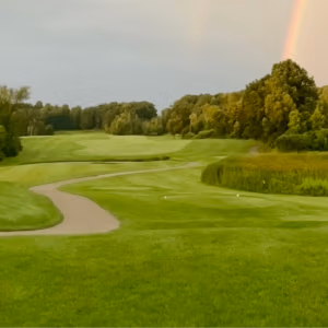 golf course with rainbow and cart path