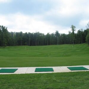 Driving range with flags and natural grass tee option