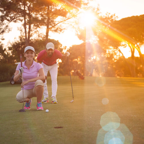 couple playing golf