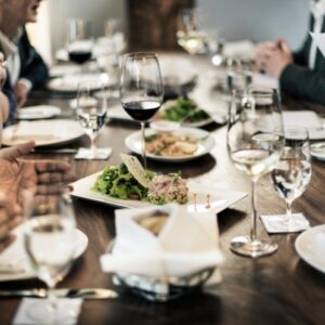 "Fundraiser dinner event at Copper Hills Golf Club near Rochester, MI with elegant table setting and wine service"