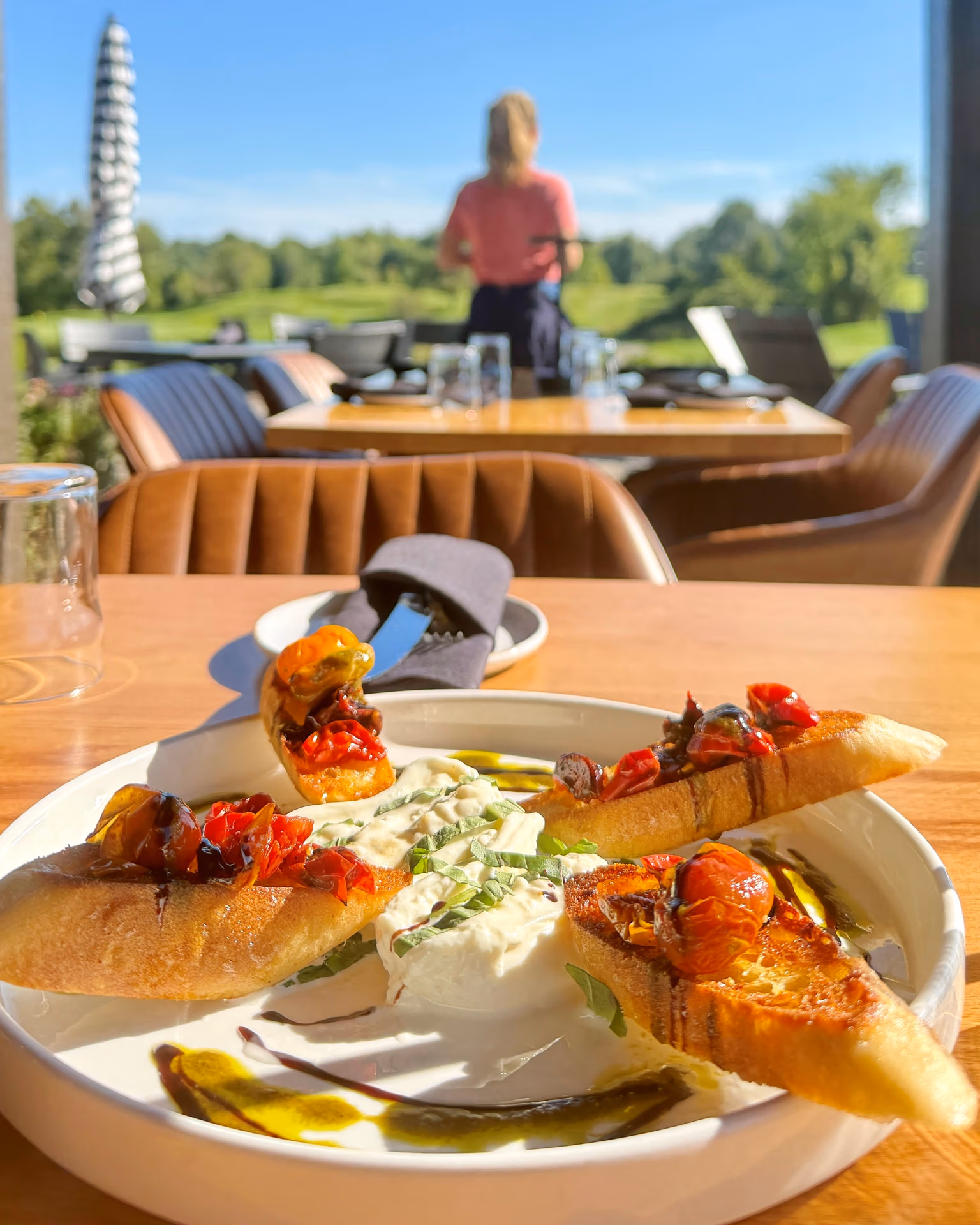 Burrata appetizer grilled tomatoes crispy bread out on patio